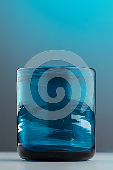 Isolated thick empty blue glass