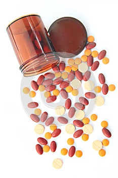 Isolated top Persepctive pills spilling out