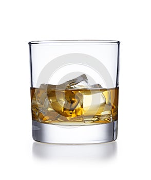 A isolated tumbler style glass of whisky and ice, shot on white