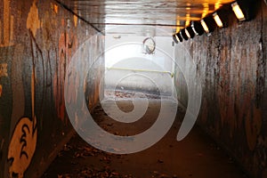 An isolated underground Subway with graffiti photo