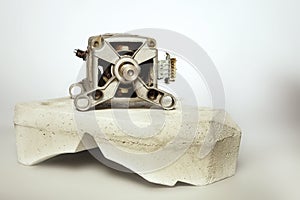 Isolated unit of washing machine electric engine and concrete stabilization weight