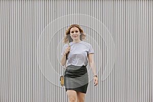 Isolated urban woman walking with casual clothes