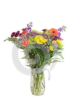 Isolated vase of colorful assorted flowers