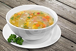 Vegetable soup on table photo