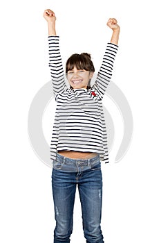 Isolated victorious little girl raising arms