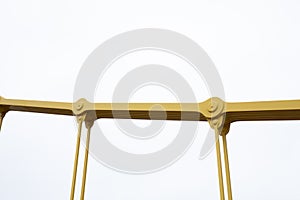 Isolated view of joints and cables from a self anchored suspension bridge painted bright yellow photo