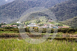 The isolated village of Bario. With rice fields surrounded by mountains and rainforest. Bario, Malaysia, Borneo, Sarawak photo