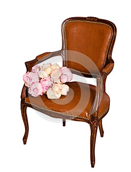 Isolated vintage brown leather armchair