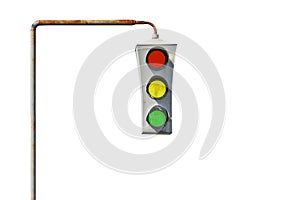 Isolated vintage old traffic light on a rusty post.