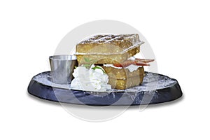 Isolated Waffle Strawerry fresh cream in the black plate on a white background with clipping path