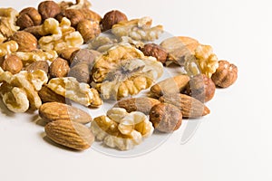 Isolated walnuts and almonds in macro view