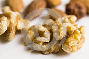 Isolated walnuts and almonds in macro view