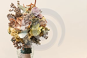 Isolated wedding bouquet with multiple flowers over plainbackground
