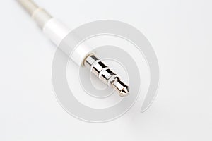 Isolated white aux cable on white background