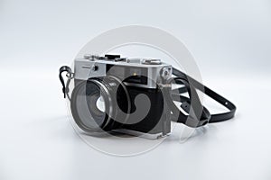 Isolated white background Beautiful vintage analog rangefinder film camera. 70`s Decade film camera. Front left view image