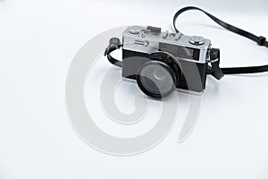 Isolated white background Beautiful vintage analog rangefinder film camera. 70`s Decade film camera. Front left view image copy