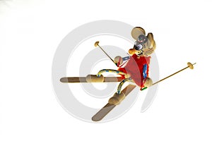 Isolated white background: a figurine of a mouse on skis