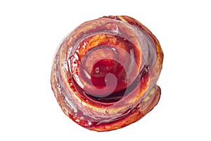 Isolated on white background fresh round snail bun cinnamon with red jam close-up top view