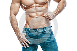 Bodybuilder posing. Beautiful sporty guy male power. Fitness muscled in blue jeans. on isolated white background