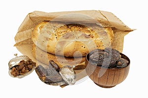 Isolated on white background, top view, palm fruit in the bread and bowls named `Pide`