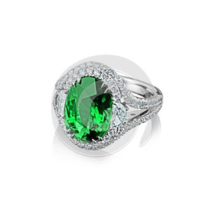 Isolated white gold ring with diamonds and huge green emerald