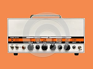 Isolated white iron modern drive medium electric guitar amplifier head on orange background with copy space.