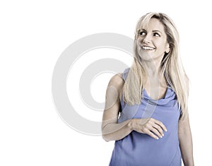 Isolated woman in blue summer shirt looking up.