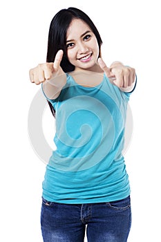 Isolated woman giving thumbs up