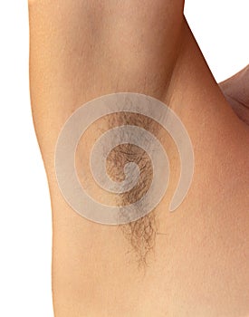 Isolated woman hairy unshaved armpit on the white background holding arm straight