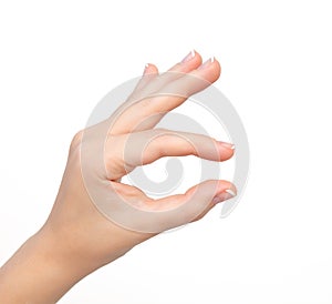 Isolated woman hand shows pinch to zoom or holding object