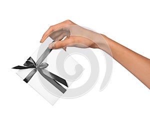 Isolated Woman Hands holding Holiday Present White Box with Grey Ribbon on a White Background