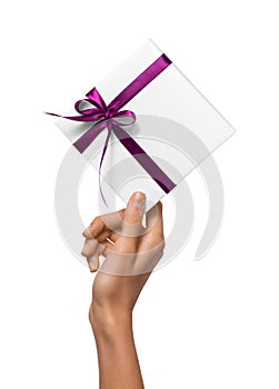 Isolated Woman Hands holding Holiday Present White Box with Pink Ribbon on a White Background