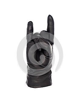 Isolated woman`s hand wearing a black leather glove in a horns gesture palm up photo