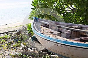 Isolated wooden boat on the beach