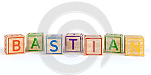 Isolated wooden toy cubes with letters with name bastian