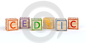 Isolated wooden toy cubes with letters with name cedric