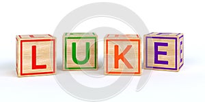 Isolated wooden toy cubes with letters with name luke