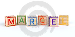 Isolated wooden toy cubes with letters with name marcel