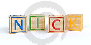 Isolated wooden toy cubes with letters with name nick