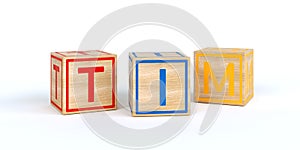 Isolated wooden toy cubes with letters with name tim