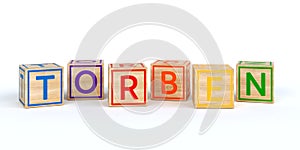 Isolated wooden toy cubes with letters with name torben