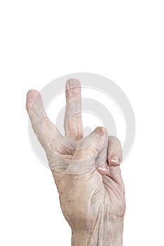 Isolated wrinkled hand of an old person making victory sign on white