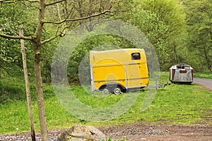 Isolated yellow caravan in the forest Germany, Europe