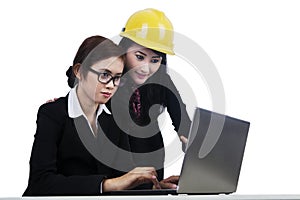 Isolated young architects working on a laptop