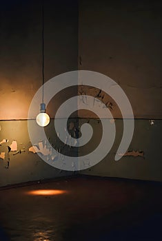Isolation And Emotional Decay Reflected By A Hanging Light Bulb In A Cracked Empty Room