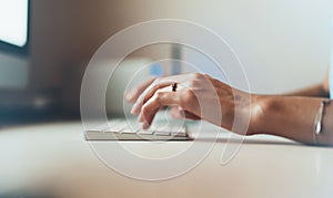 Isolation person working at home, freelancer typing on keyboard, closeup finger female hands texting message, education process