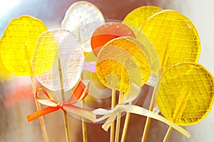 Isomalt lollipops cockerels on sticks candies. Candy, lollipop, bonbon, no-sugar candy. Sweetmeat no shugar added. Isomalt