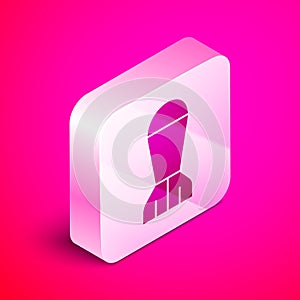 Isometric Aviation bomb icon isolated on pink background. Rocket bomb flies down. Silver square button. Vector