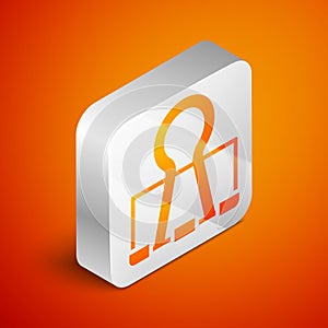 Isometric Binder clip icon isolated on orange background. Paper clip. Silver square button. Vector