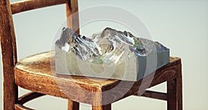 Isometric mountain on wooden chair. Wanderlust and adventure concept